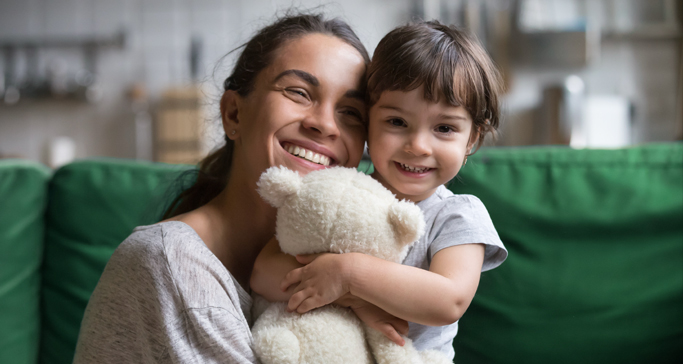 mother and daughter smiling